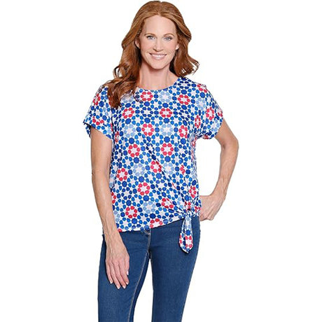 Woman wearing a floral patterned top on a white background