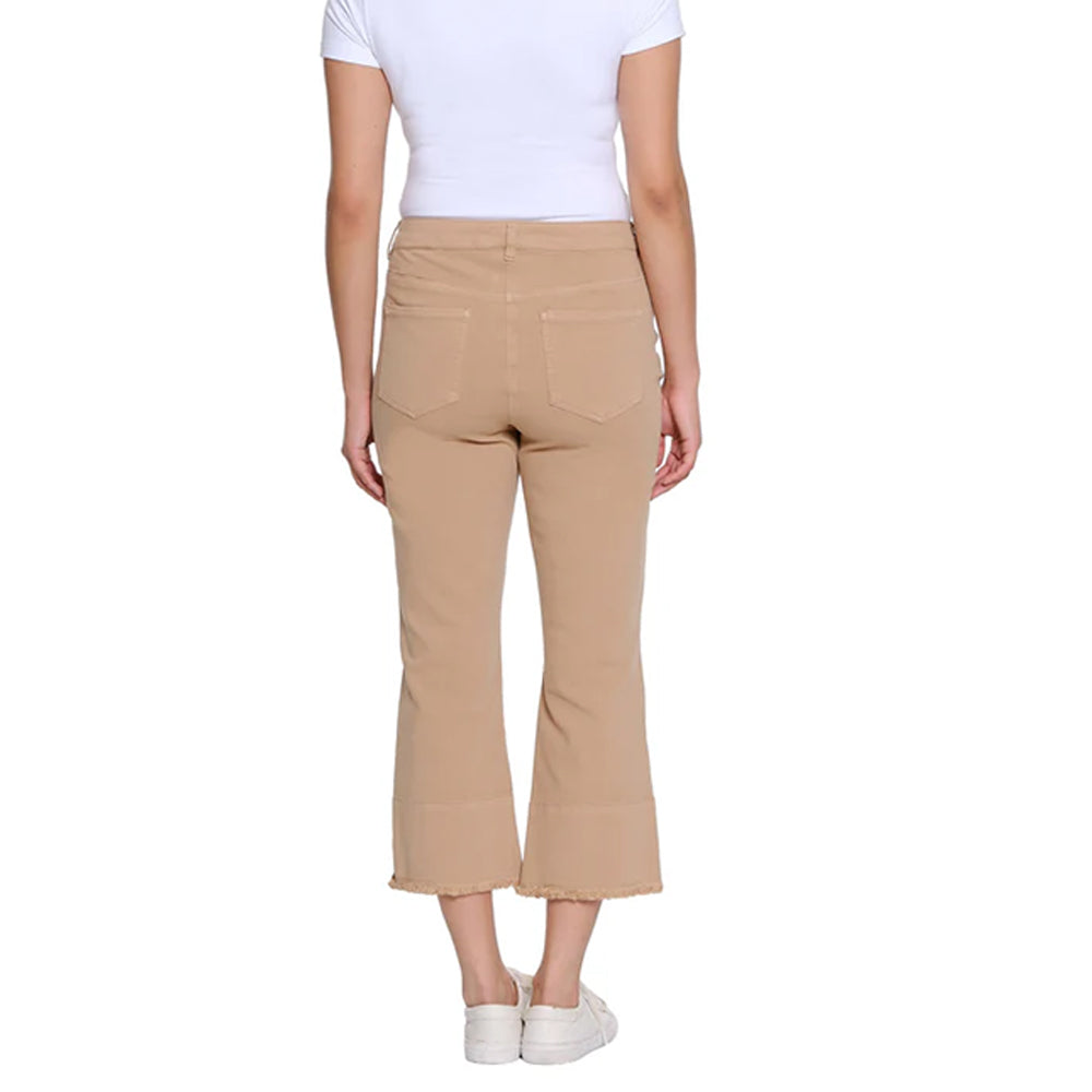 Person wearing beige pants and a white shirt on a white background