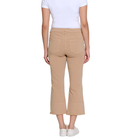 Person wearing beige pants and a white shirt on a white background