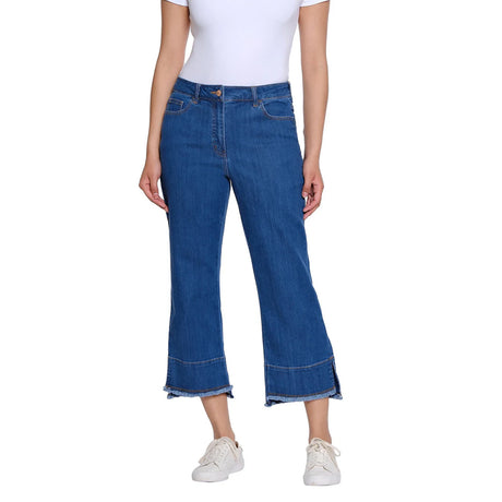 Person wearing blue jeans and a white top on a white background