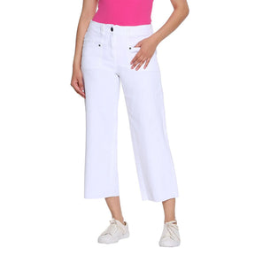 Person wearing white capri pants on a white background