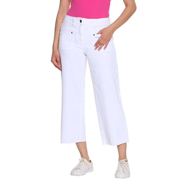 Person wearing white capri pants on a white background