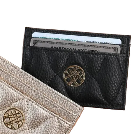Black leather wallet with gold emblem on a beige background