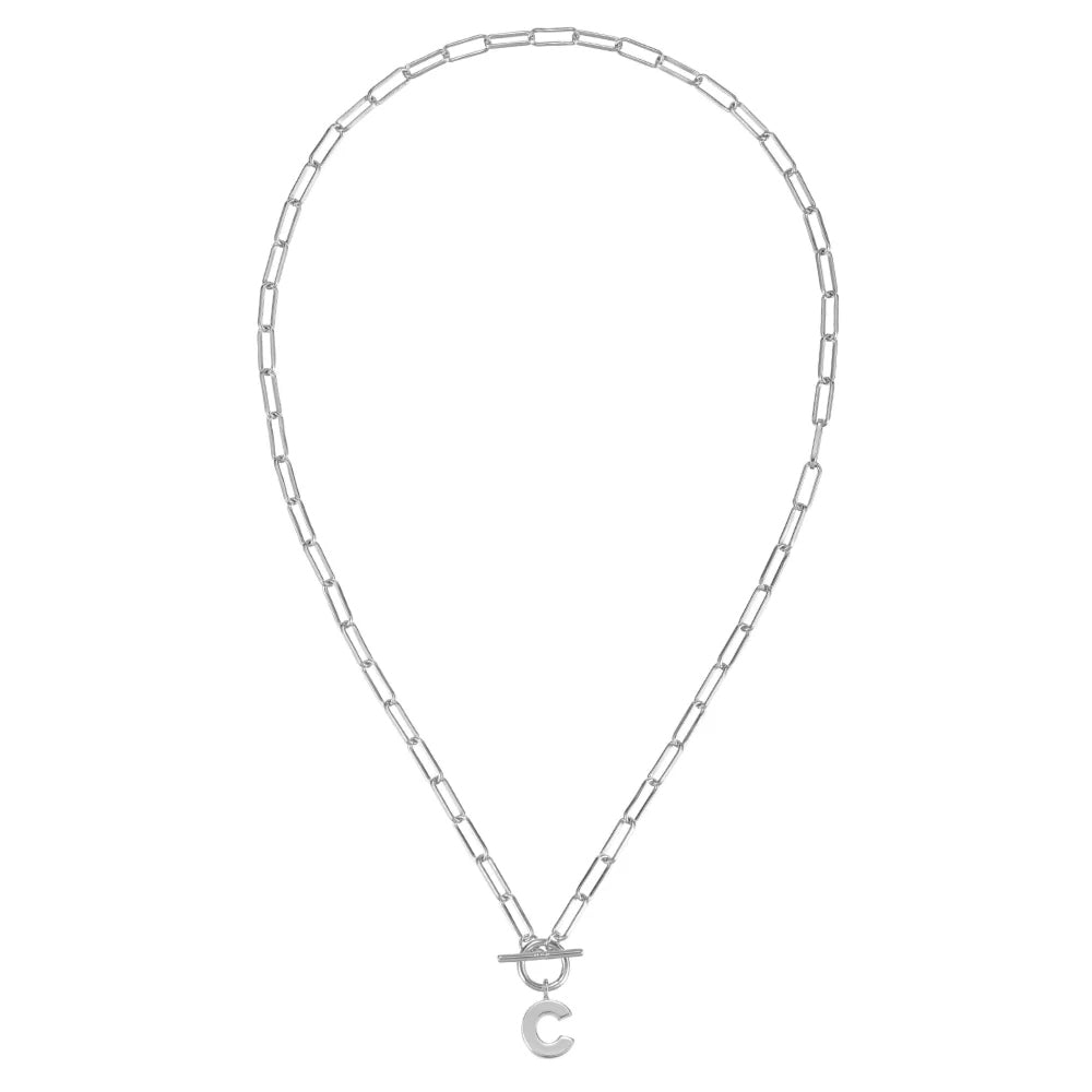 Silver necklace with a small circular pendant on a white background