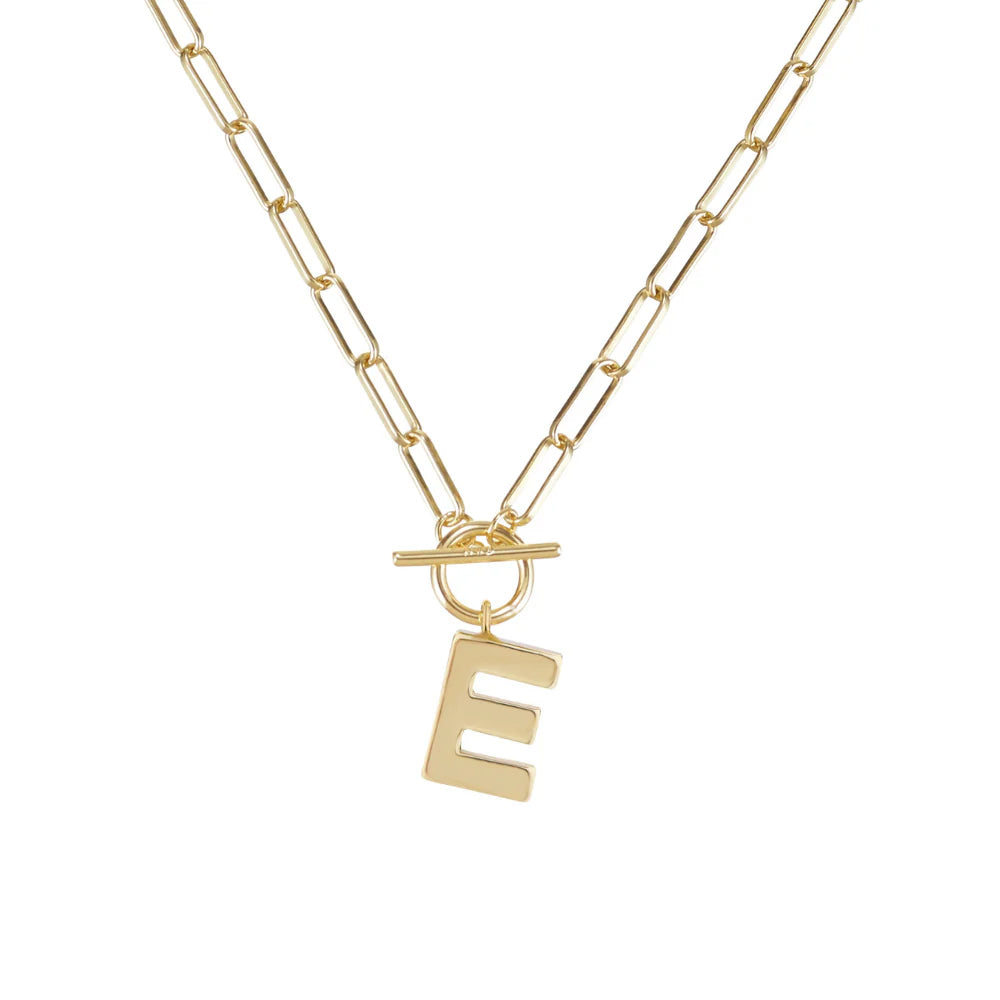 Gold necklace with a 'E' pendant on a white background