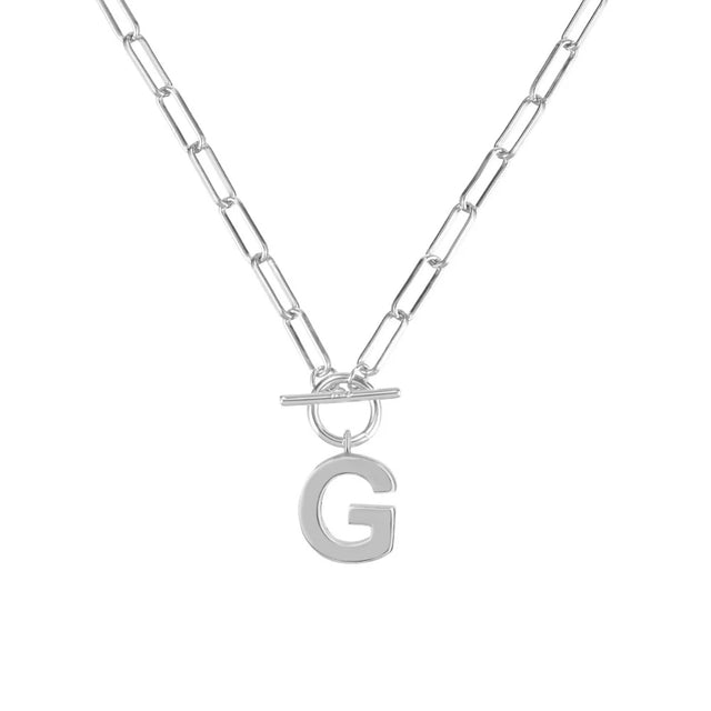 Silver necklace with a letter 'G' pendant on a white background