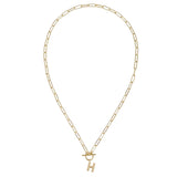 Gold chain necklace with a small gold 'H' pendant on a white background