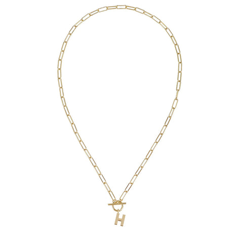 Gold chain necklace with a small gold 'H' pendant on a white background