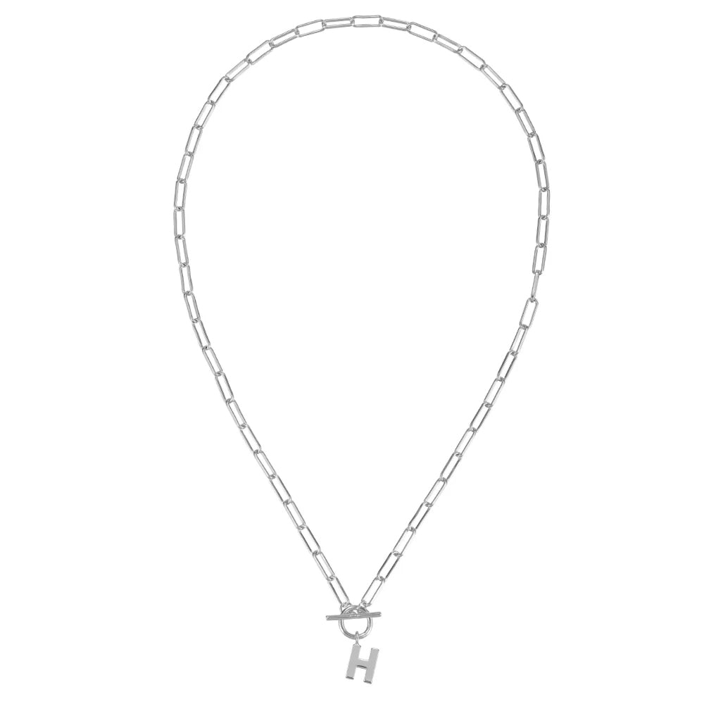 Silver necklace with a 'H' pendant on a white background