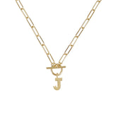 Gold necklace with a 'J' pendant on a white background