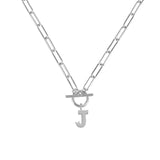 Silver necklace with a letter 'J' pendant on a white background
