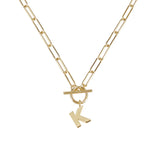 Gold necklace with a 'K' pendant on a white background