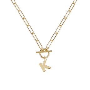 Gold necklace with a 'K' pendant on a white background