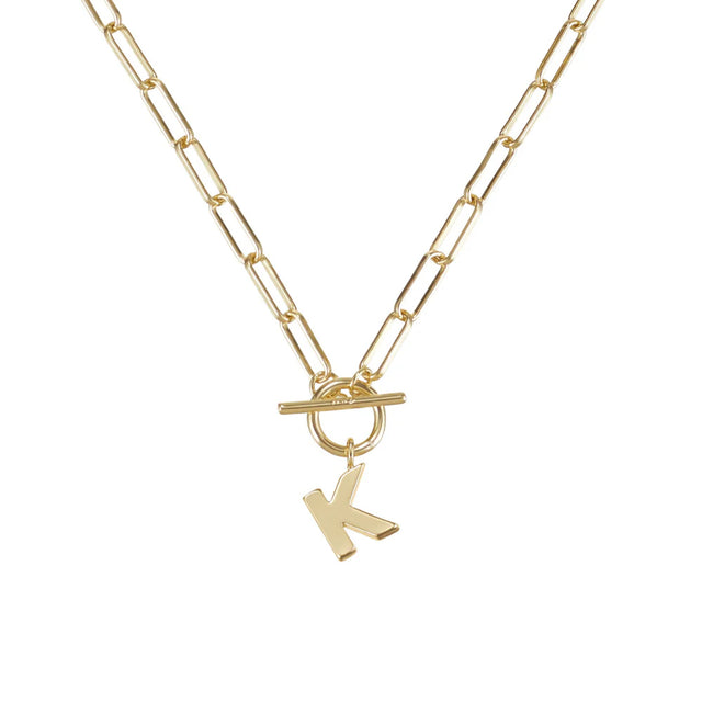 Gold necklace with a 'K' pendant on a white background