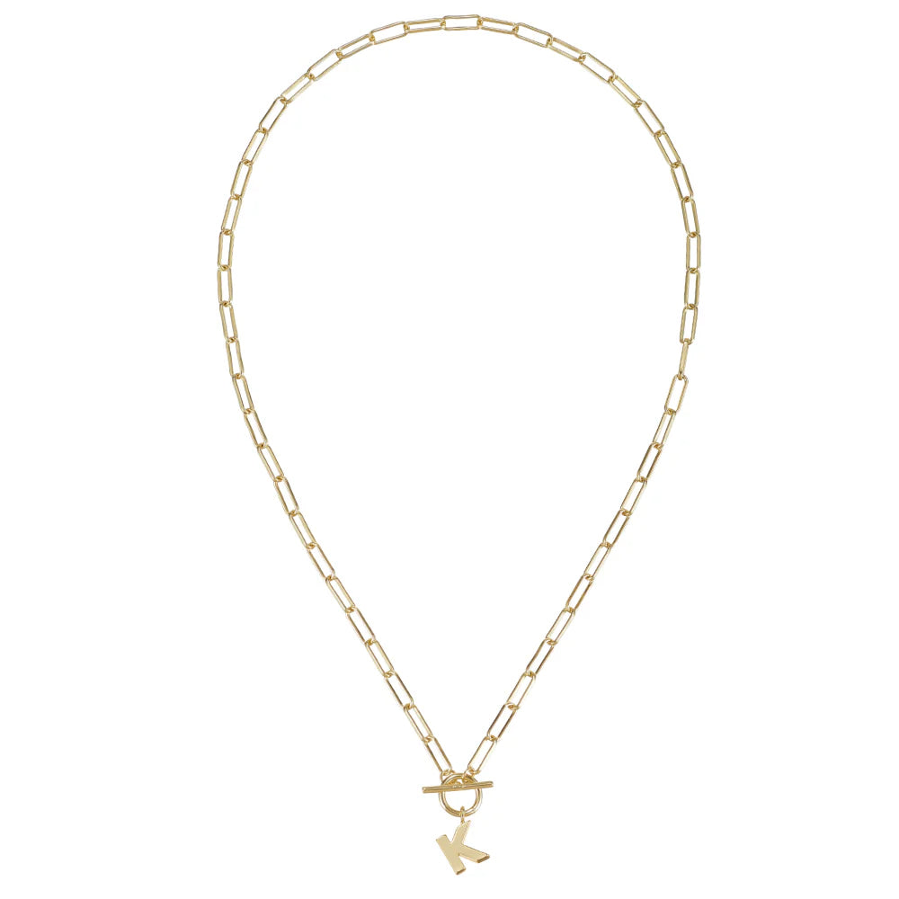 Gold necklace with a small pendant on a white background
