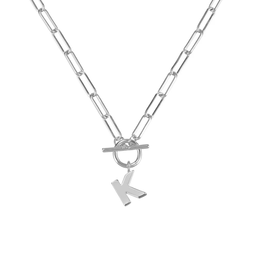 Silver necklace with a 'K' pendant on a white background