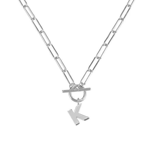 Silver necklace with a 'K' pendant on a white background