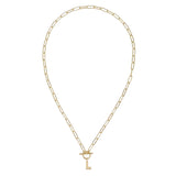 Gold chain necklace with a key pendant on a white background