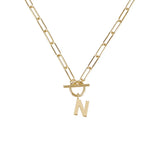 Gold necklace with a 'N' pendant on a white background