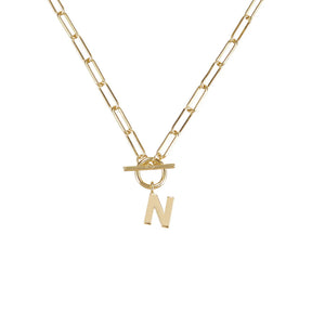 Gold necklace with a 'N' pendant on a white background