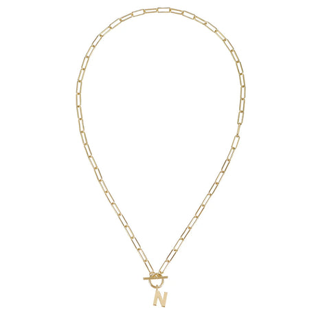 Gold necklace with a letter 'N' pendant on a white background