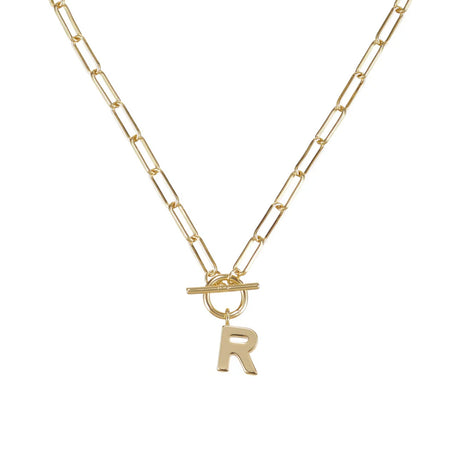 Gold necklace with a letter 'R' pendant on a white background
