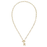Gold chain necklace with a letter 'R' pendant on a white background