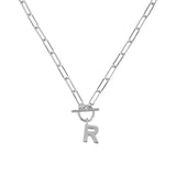 Silver necklace with a letter 'R' pendant on a white background