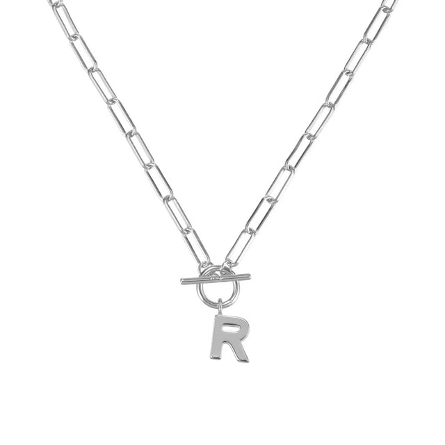 Silver necklace with a letter 'R' pendant on a white background