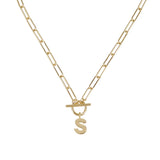 Gold necklace with a letter 'S' pendant on a white background