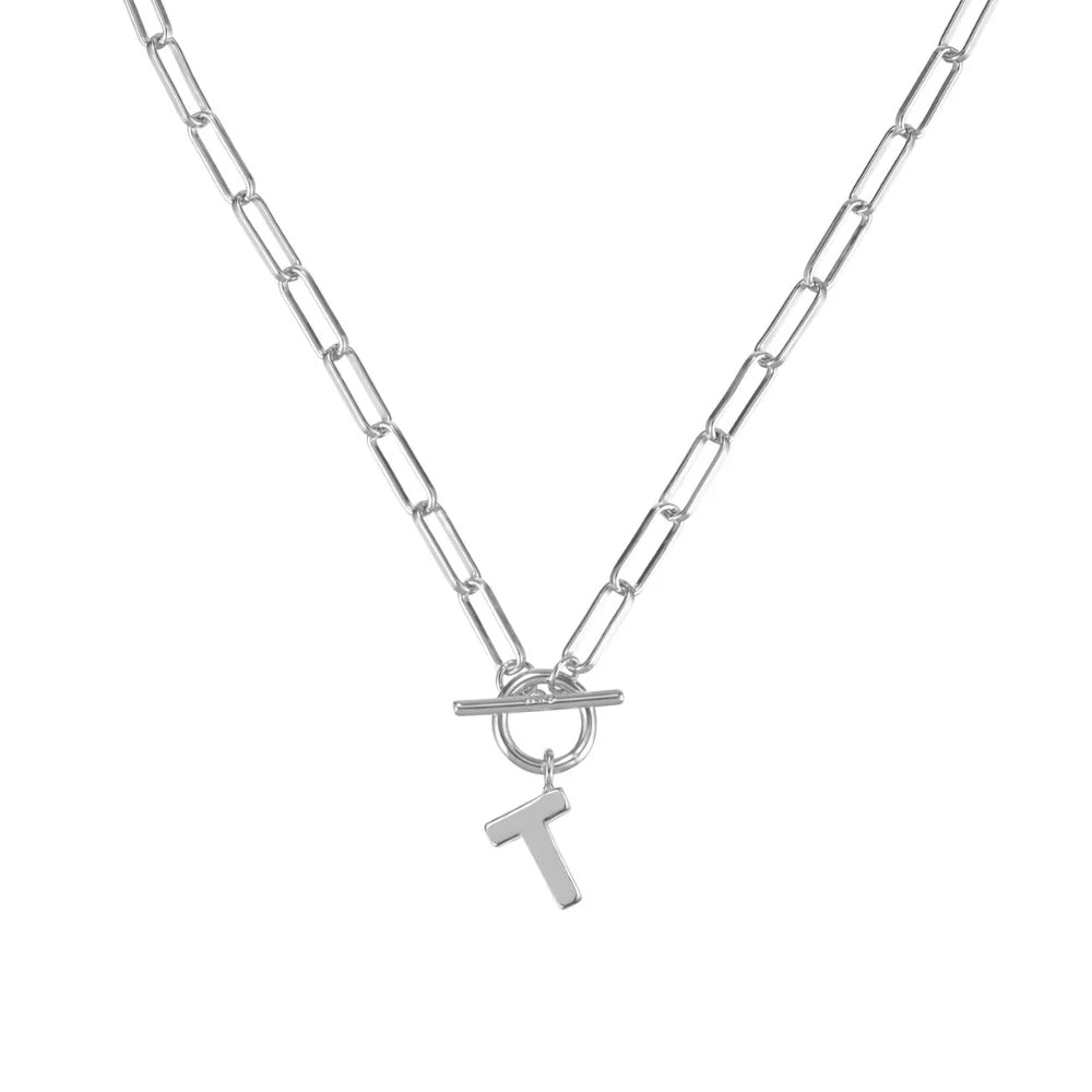 Silver necklace with a letter 'T' pendant on a white background