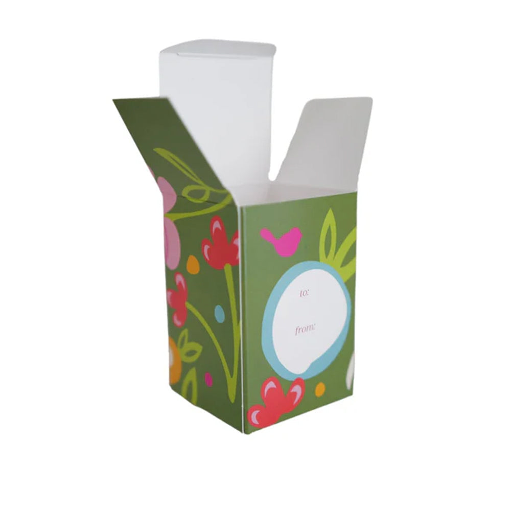 Decorative green box with floral designs on a white background