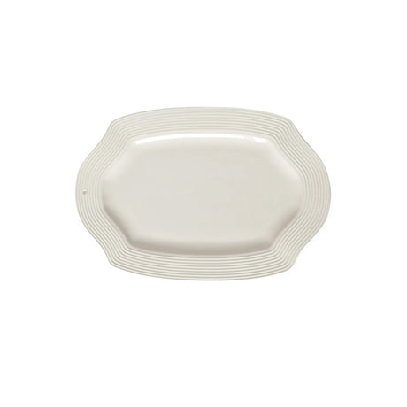 White ceramic platter with wavy edge on a white background