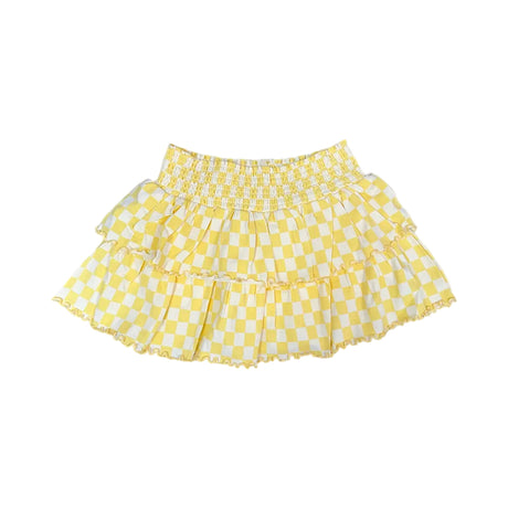 Yellow checkered skirt on a light yellow background