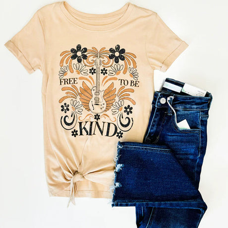 Beige t-shirt with 'Free to be Kind' design and blue jeans on a white background
