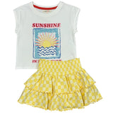 Children's outfit with a white top and yellow checkered skirt on a white background