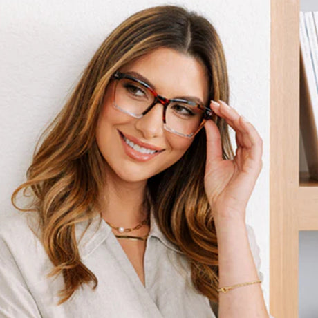 Woman wearing glasses with a neutral background
