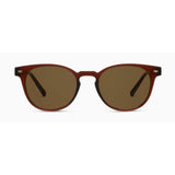 Sunglasses with brown lenses and red frame on a white background