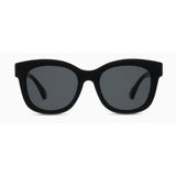 Black sunglasses with dark lenses on a white background