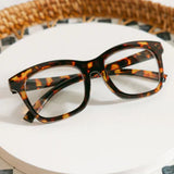 Tortoiseshell cat-eye glasses on a white background
