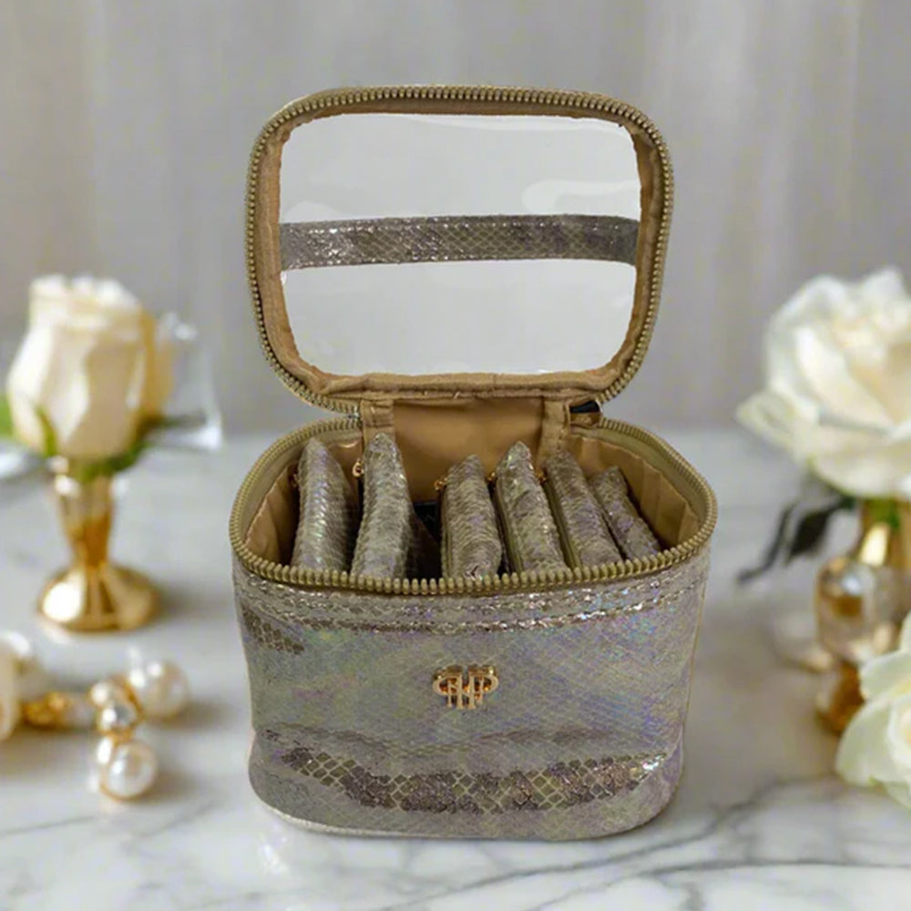 Decorative jewelry box with mirror on a marble surface with decorative elements.