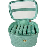 Mint green jewelry case with quilted design and clear top compartment on a white background