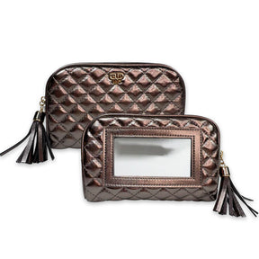 Two quilted handbags with tassels on a white background