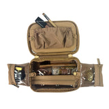 Open tan tactical pouch with various items on a white background