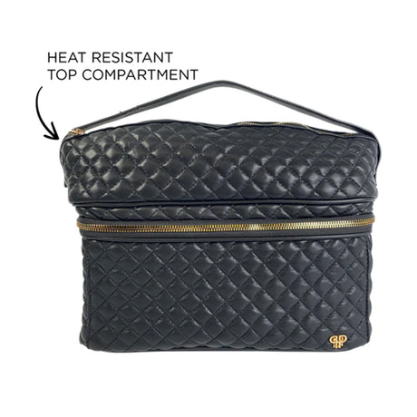 Black quilted makeup bag with gold zipper and heat resistant top compartment label on a white background
