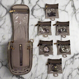Set of small bags and pouches on a marble surface