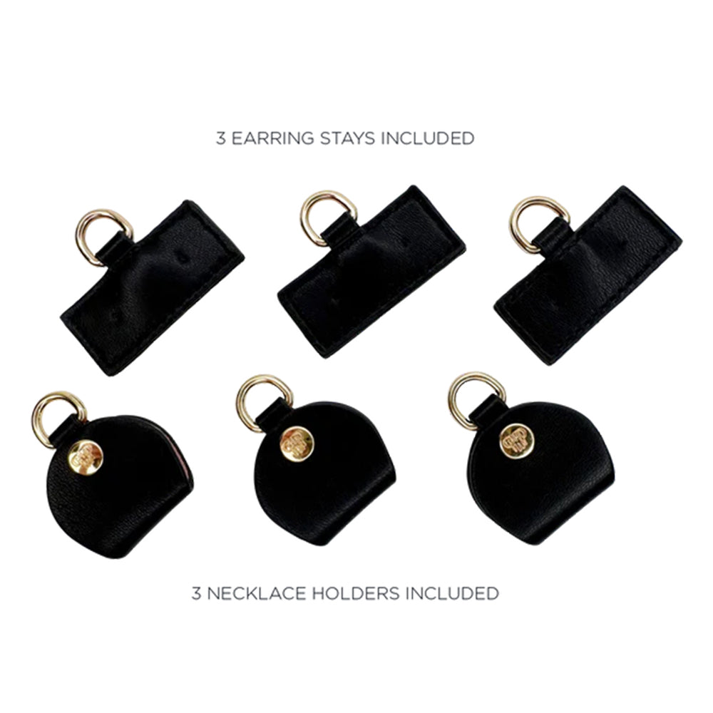 Black earring stays and necklace holders on a white background