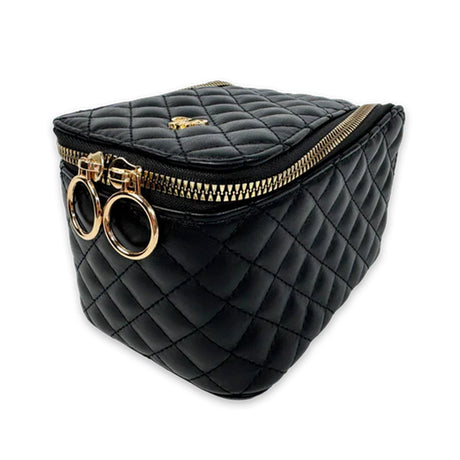 Black quilted bag with gold zipper and circular handles on a white background