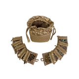 Gold jewelry set with a drawstring bag on a white background