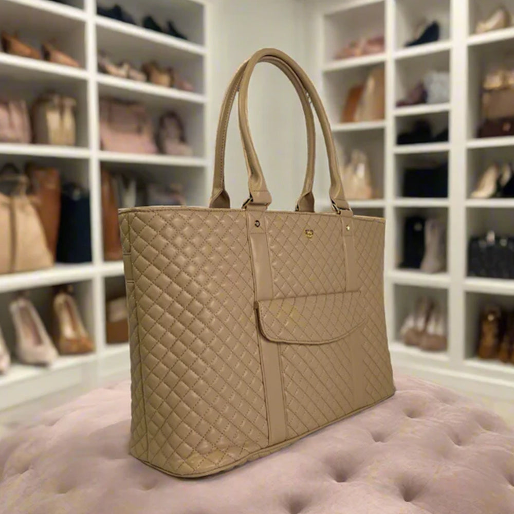 Beige quilted handbag on a pink cushion with a background of shelves filled with shoes